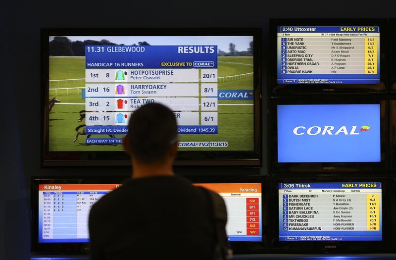 Television screens display horse racing results inside a betting shop. File image. Photograph: Chris Ratcliffe/Getty