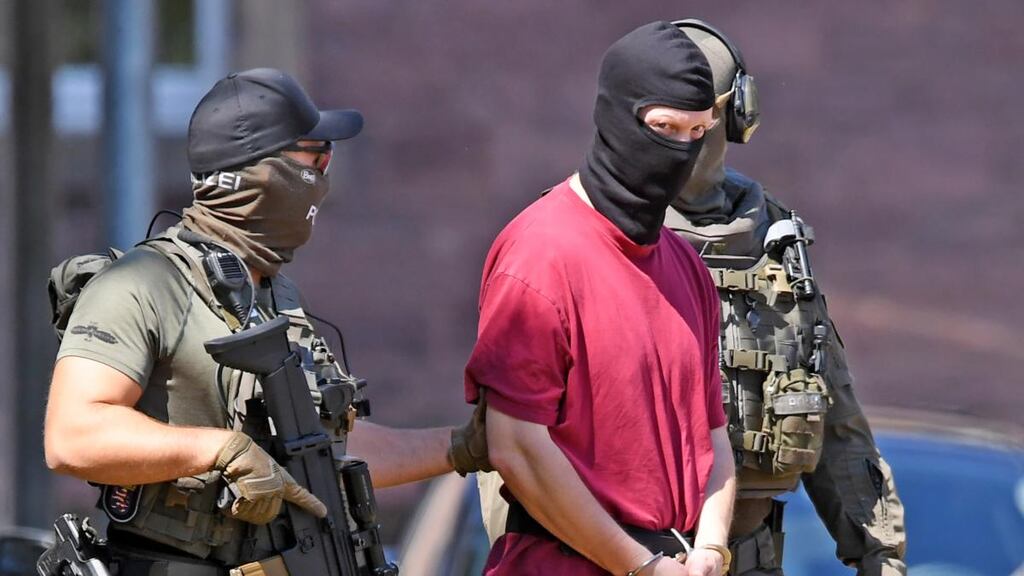 Stephan Ersnt, supected of killing the administrative chief of the western German city of Kassel, Walter Lübcke, being escorted by police at the federal court of justice in Karlsruhe on Tuesday. Photograph: Uli Deck/AFP/Getty Images