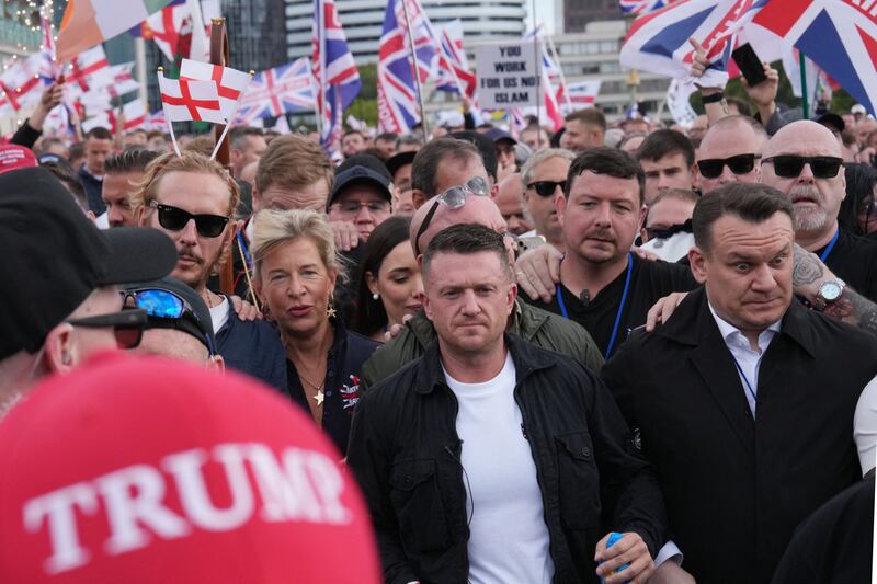 Far-right activist Tommy Robinson (centre), real name Stephen Yaxley-Lennon, marches through central London with supporters including far-right commentator Katie Hopkins (centre left) and actor Laurence Fox (left). Photograph: Carlos Jasso/AFP via Getty Images