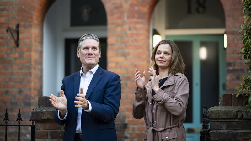 Labour leader Sir Keir Starmer and his wife Victoria applaud for key workers outside their home in London. Starmer’s net favourability rating passed the prime minister’s this week. Photograph: Justin Setterfield/Getty Images