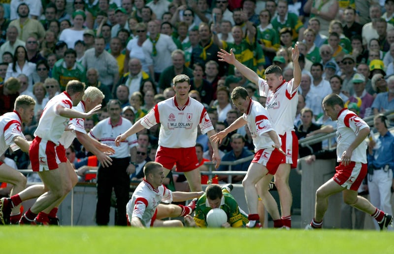 Tyrone's intense defensive style in action as several players converge on a lone Kerry player during the All-Ireland semi-final at Croke Park. Photograph: Morgan Treacy/Inpho 