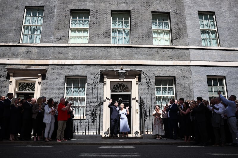 Britain's new prime minister Andy Burnham and his wife Marie-France van Heel pose on the steps of 10 Downing Street in central London on July 20th, 2026, after being asked by the British king to form the next government. Photograph: AFP via Getty Images