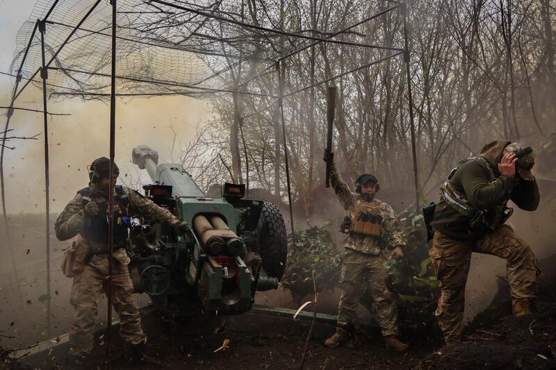 Ukrainian soldiers fire a howitzer at the frontline near Bakhmut, Donetsk region. Photograph: Roman Chop via AP