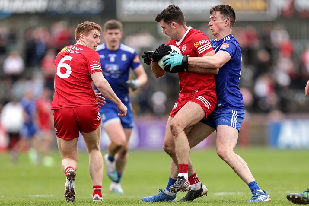 Tyrone's Darren McCurry and Shane Carey of Monaghan during the Ulster championship clash at Omagh. Photograph: Laszlo Geczo/Inpho