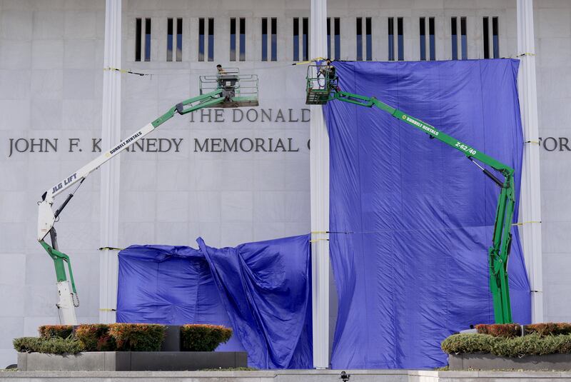 Workers affix signage adding US president Donald Trump's name to the facade of the Kennedy Center in Washington, DC, last December. Photograph: Al Drago/Bloomberg via Getty Images