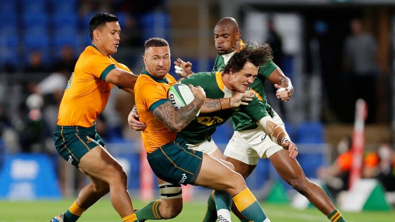 Australia’s  Quade Cooper attempts to spin out of a tackle from South Africa’s  Franco Mostert during the Rugby Championship  match  at Cbus Stadium on Australia’s Gold Coast. Photograph: Regi Varghese/EPA