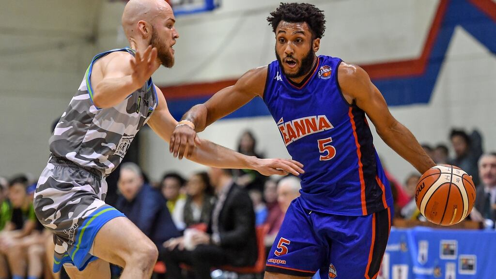 Joshua Wilson of DBS Éanna in action against Paul Dick of Garvey’s Tralee Warriors during the Hula Hoops Men’s Pat Duffy National Cup semi-final at Neptune Stadium in Cork. Photograph: Brendan Moran/Sportsfile