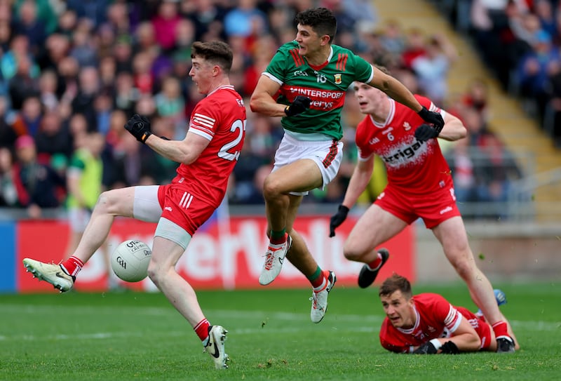 Derry’s Gareth McKinless blocks Tommy Conroy of Mayo shot resulting in a penalty. Photograph: James Crombie/Inpho