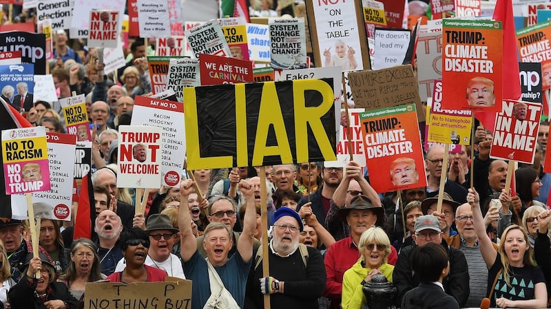 People take part in n anti-Trump protest at Trafalgar Square in London. Photograph: Andy Rain/EPA