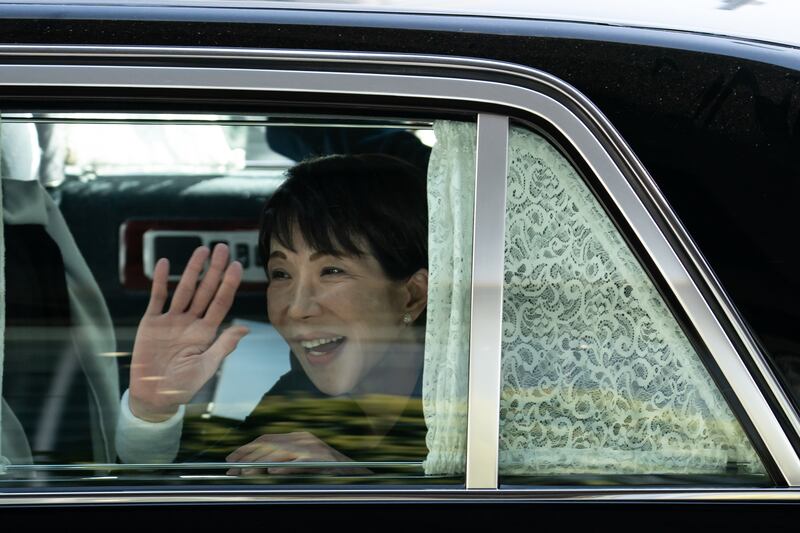 Sanae Takaichi waves through the window of her vehicle as she leaves an election campaign rally. Photograph: Tomohiro Ohsumi/Getty Images