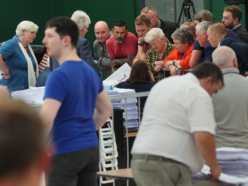 Candidates and agents observe as the returning officer presents them with doubtful ballots at Nemo Rangers GAA club in Cork, during the count for the European elections. Photograph: Jonathan Brady/PA Wire