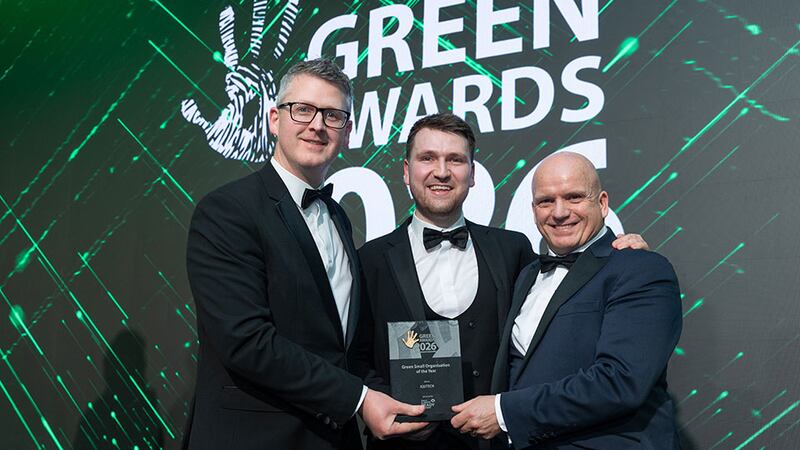 Michael Twomey, marketing manager at Skillnet Climate Ready Academy, presents the green small organisation of the year to Mark O'Sullivan and Evan O'Brien, IQUTECH