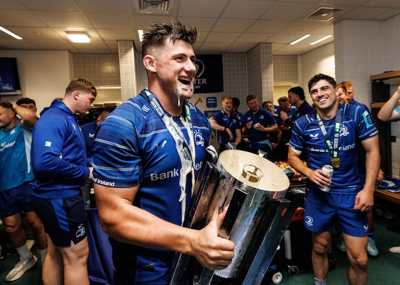 Dan Sheehan drinks from the URC trophy in the dressingroom after Saturday's final. Photograph: Ben Brady/Inpho