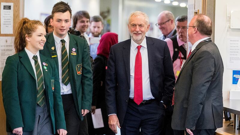 Labour leader Jeremy Corbyn with head girl Lucy Symington (left) and head boy Michael Hare (second left) walking into the library at Lagan College, Northern Ireland’s first integrated school, during Mr Corbyn’s first visit to Northern Ireland as party leader. Photograph: Liam McBurney/PA Wire