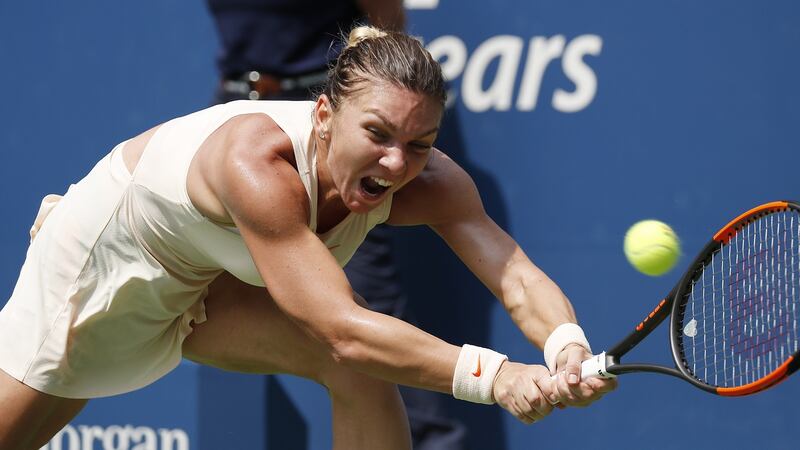 Halep hits a return during her loss to Kaia Kanepi. Photo: John G Mabanglo/EPA