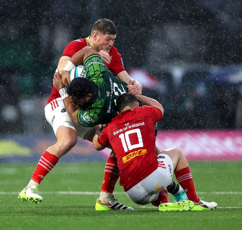 Connacht's Bundee Aki tackled by Jack O'Donoghue and Tony Butler of Munster. Photograph: James Crombie/Inpho