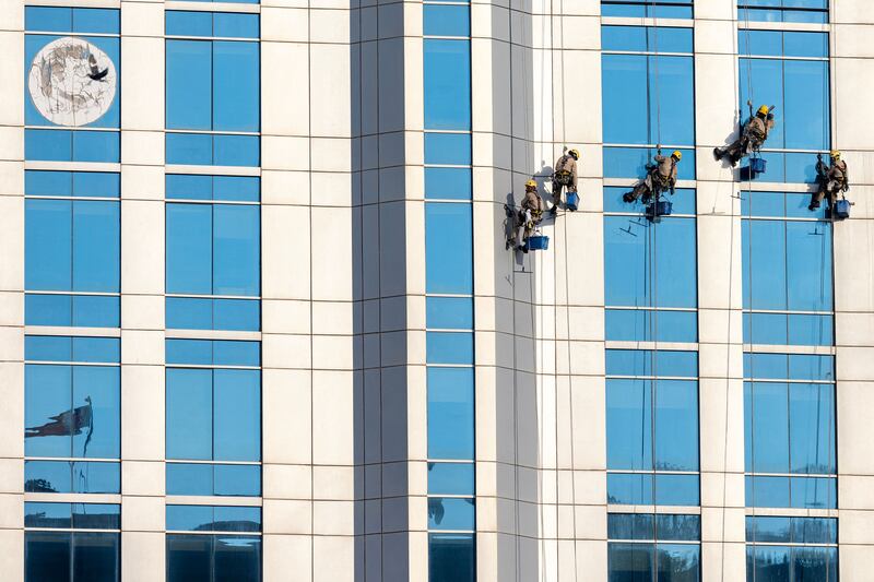 Workers clean the windows of a high-rise building in Doha on November 11th, 2022, ahead of the Qatar 2022 Fifa World Cup football tournament. Photograph: Odd Andersen/AFP/Getty 