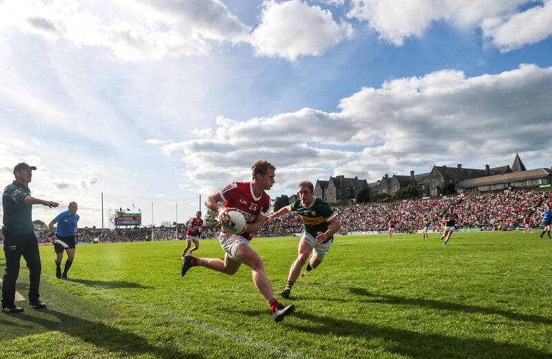 Cork's Ruairí Deane is challenged by Stephen O’Brien of Kerry in the Munster SFC semi-final at Fitzgerald Stadium in Killarney. Photograph: Bryan Keane/Inpho