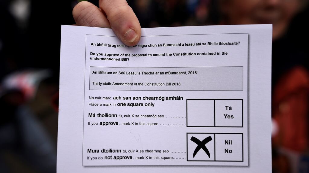 A demonstrator holds up a mock referendum polling-card during a ‘Pro-Life’ rally. REUTERS/Clodagh Kilcoyne