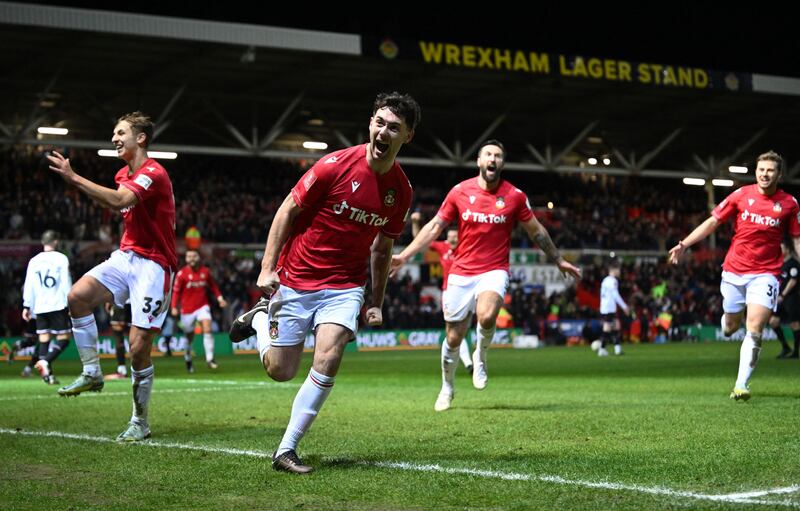 Wrexham's Irish midfielder Tom O'Connor celebrates scoring his team's second goal during the FA Cup fourth-round match against Sheffield United at the Racecourse Ground. Photograph: Oli Scarff/AFP via Getty Images