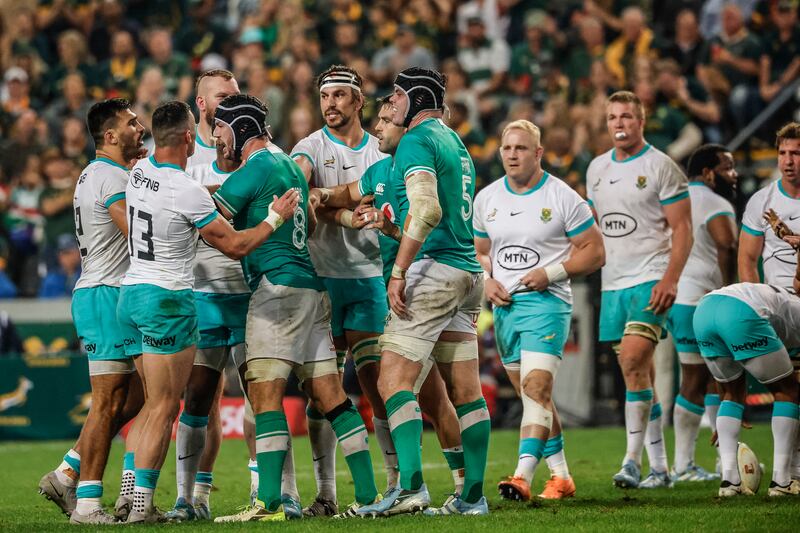 South Africa's inside centre Damian de Allende and Ireland's number eight Caelan Doris (3rd L). Photograph: Wikus de WEt/AFP via Getty Images 