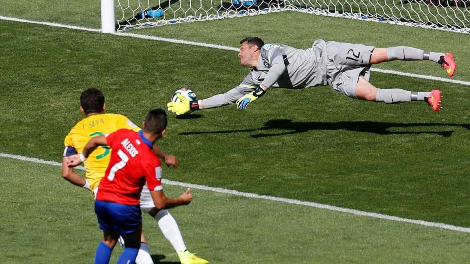 Chile’s Alexis Sanchez scores the equaliser against Brazil at the Mineirao Stadium in Belo Horizonte. Photograph: Leonhard Foeger / Reuters
