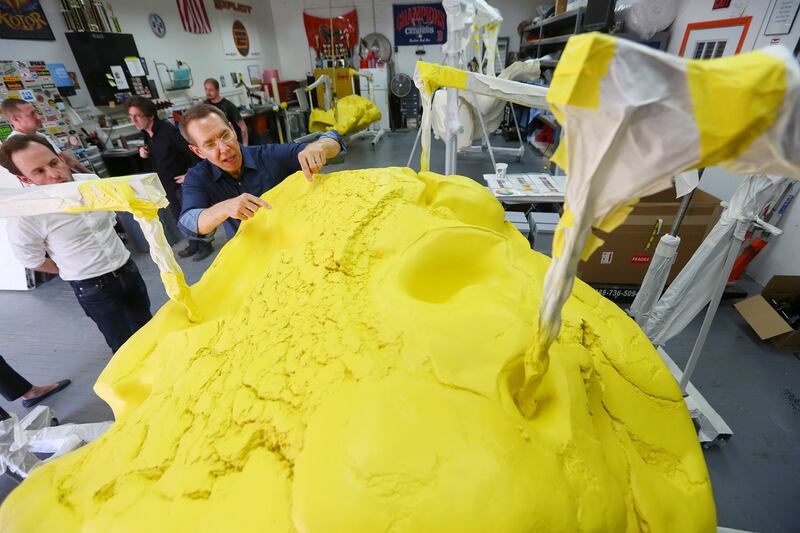 Almost all successful artists have assistants: Jeff Koons directs painting work on his piece Play-Doh, in 2014. Photograph: Chang W Lee/New York Times