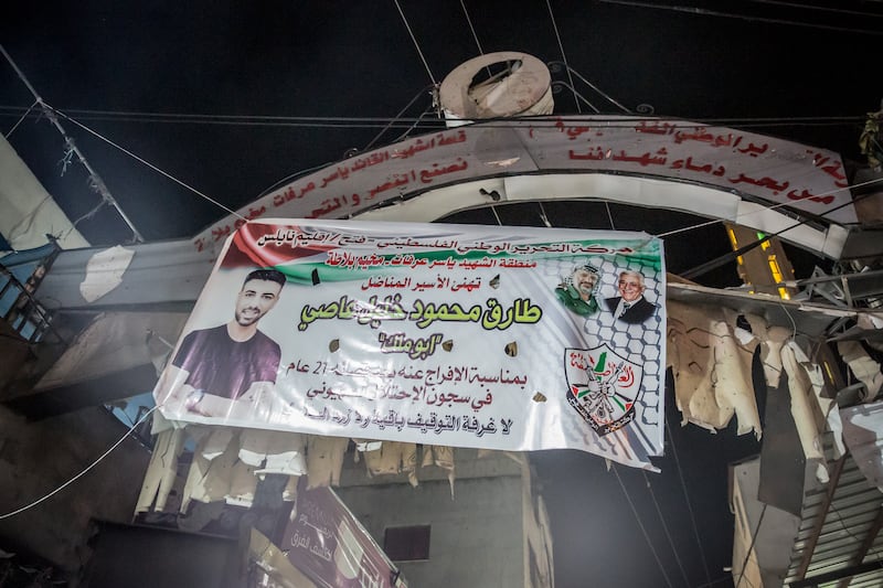 A poster at the entrance to Balata refugee camp welcomes Tariq Assi home. Photograph: Sally Hayden