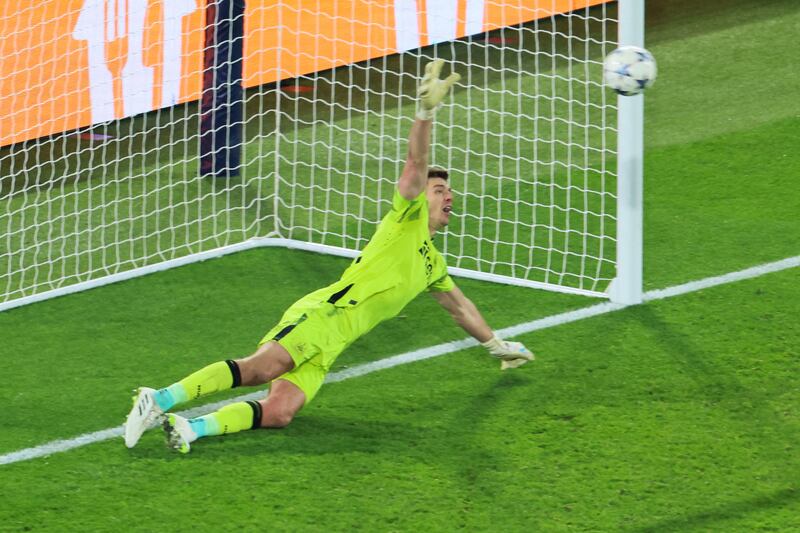Newcastle United's English goalkeeper Nick Pope dives but can't stop a penalty from Kylian Mbappé. Photograph: Alain Jocard/AFP via Getty Images  