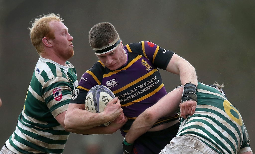 Greystones' Shane Fikken and Stephen Bourke tackle David Whitten of Instonians. Photograph: Leah Scholes/Inpho