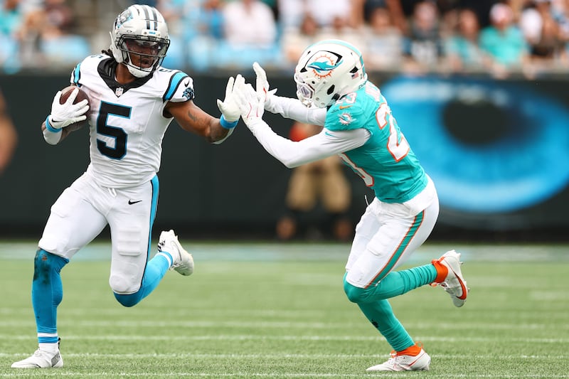 Rico Dowdle of the Carolina Panthers attempts to fend of the tackle of Jack Jones of the Miami Dolphins during the second quarter in the game at Bank of America Stadium in Charlotte, North Carolina. Photograph: Grant Halverson/Getty Images