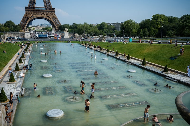 People cool off in the Trocadero Fountain in front of the Eiffel Tower in Paris on Wednesday. Photograph: Dimitar Dilkoff/AFP via Getty Images          