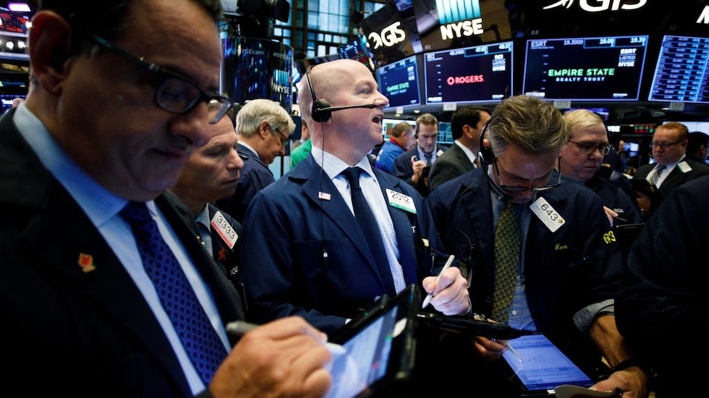 Traders work on the floor of the New York Stock Exchange. Photograph: Justin Lane/EPA