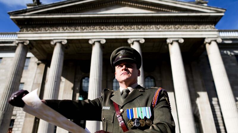 Capt Peter Kelleher prepares to read the Proclamation of the Irish Republic at the GPO on Easter Sunday, 2016 as part of the 1916 centenary commemorations. Photograph: Maxwells