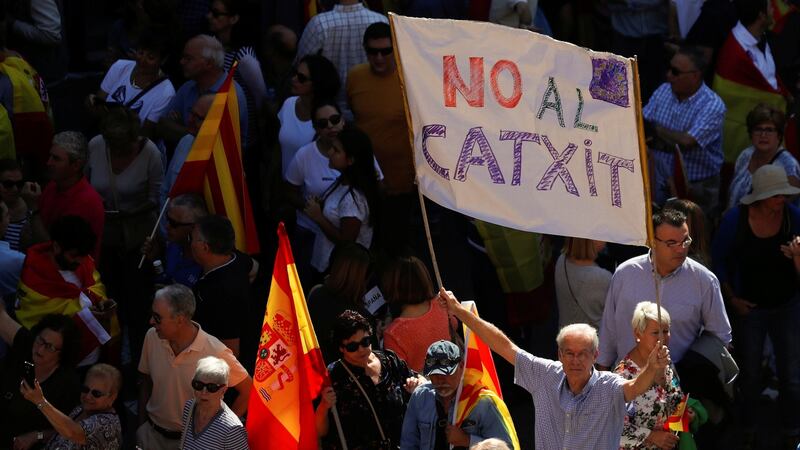 A man holds up a banner reading ‘No Catxit’ in reference to a Catalan Brexit, during a pro-union demonstration organised by the Catalan Civil Society organisation in Barcelona, Spain on Sunday. Photograph: Rafael Marchante/Reuters