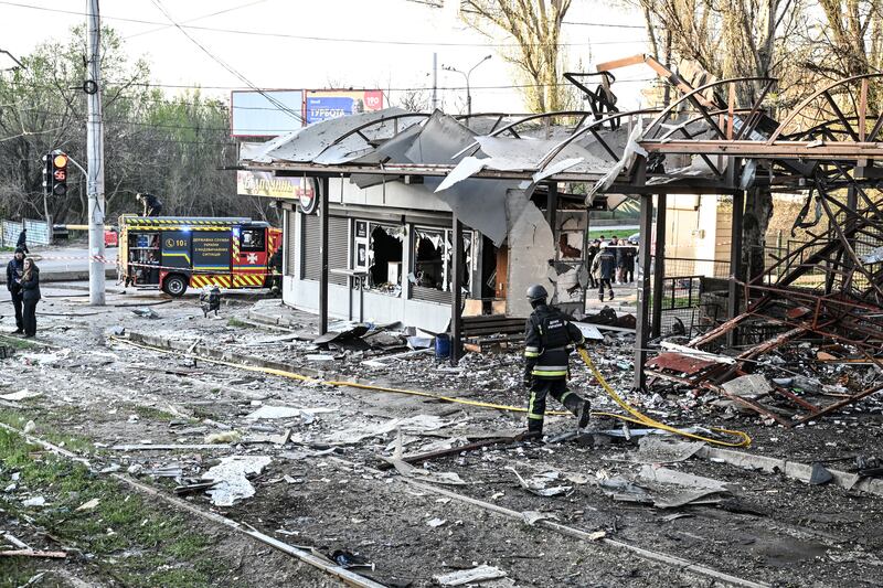 Rescuers work at a public transport stop damaged by a drone strike in Zaporizhzhia earlier this month. Photograph: Dmytro Smolienko/Ukrinform/NurPhoto/Getty