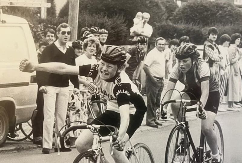 A victorious Dermot Sugrue racing in Clonakilty in 1986, watched by his father Ronan Sugrue in dark jumper and pale trousers. Photograph: Irish Examiner