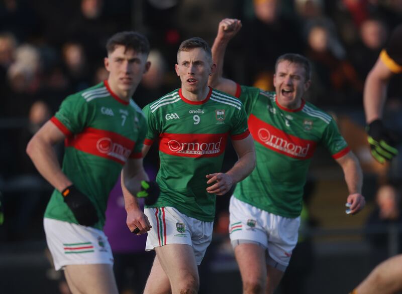 Loughmore Castleiney's Liam Treacy scores a point as Noel McGrath celebrates during the Munster club SFC final against Dr Crokes in Mallow. Photograph: Tom Maher/Inpho