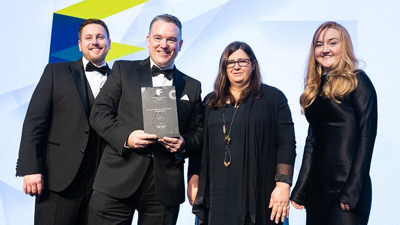 Paul Hanlon, commercial manager, Pro-Light, presents the Fit Out Project of the Year – Hospitality award to Pure Fitout team.