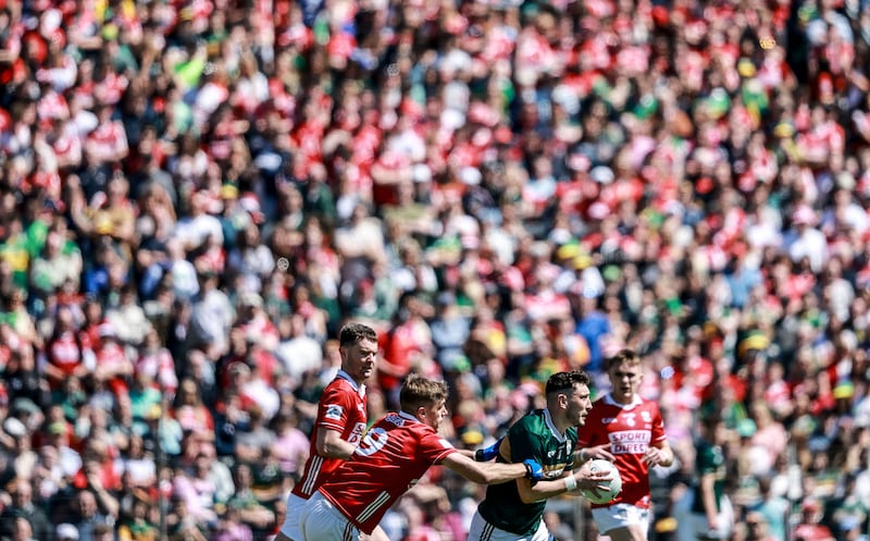 Cork’s lan Maguire with Paudie Clifford of Kerry in the Munster football final. Photograph: Dan Sheridan/Inpho
