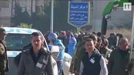 Syrians leave rebel-held Homs area in truce deal