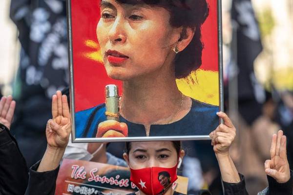 Aung San Suu Kyi appears in Myanmar court wearing prison uniform