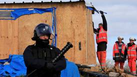 France begins to dismantle part of Calais migrant camp