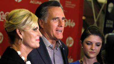 ‘Mitt’ peels the plastic away from Romney