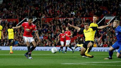 Marcus Rashford double sends holders Manchester United through