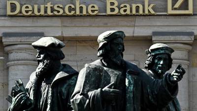 Deutsche Bank pledges to boost dividend and cut jobs