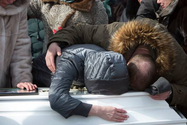 Anger mounts on day funerals begin of Russia blaze victims