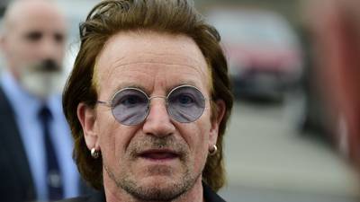 Bono promises quick return to concert tour after voice failure