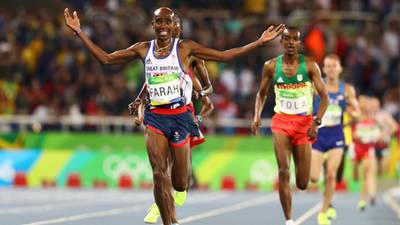 Mo Farah joins pantheon of greats as he defends 10,000m title