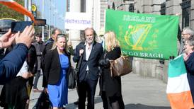 Crowd of Gemma O’Doherty and John Waters supporters gather at court